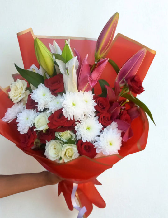 Elegant bouquet featuring 25 white and red roses, 2 lilies, and 2 chrysanthemums.