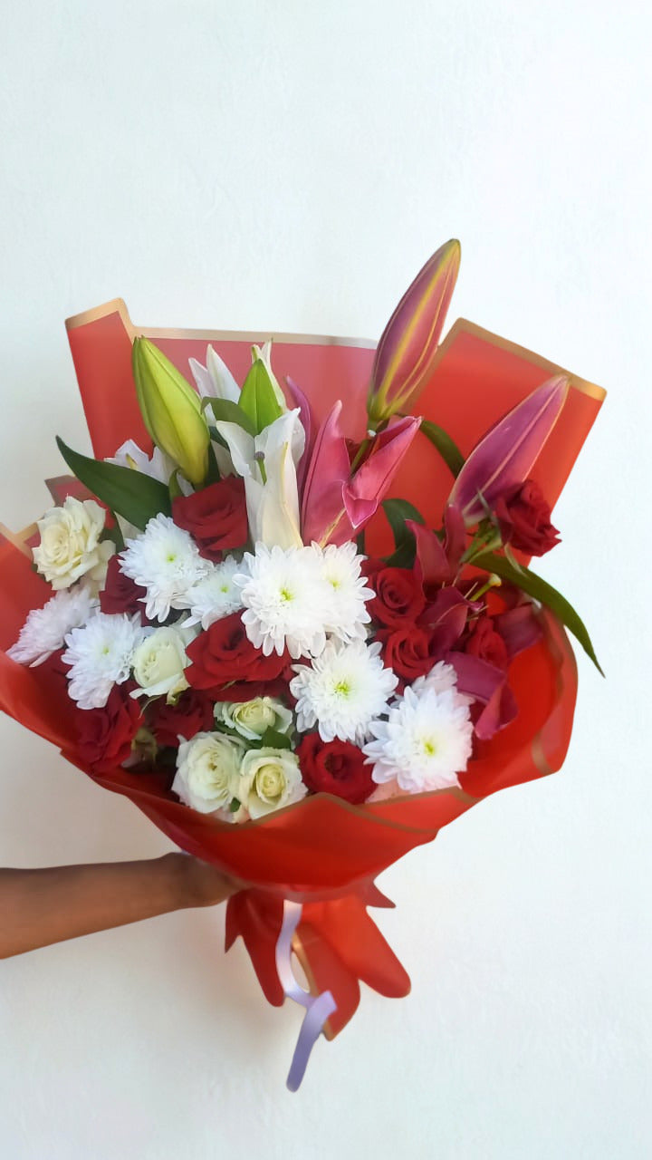 Elegant bouquet featuring 25 white and red roses, 2 lilies, and 2 chrysanthemums.